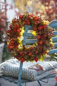 Autumn wreath of physalis (lantern fruit), rose (rosehip)