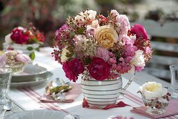 Autumnal rose table decoration on the terrace