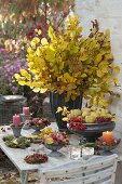 Bouquet made of fagus (beech) branches, bowls of quince