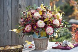 Autumn bouquet with Rose, cotoneaster with berries