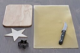 Cutting out stars from beeswax (1/3)