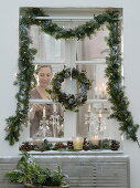 Christmas window decoration with view into the room