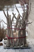 Large glasses with driftwood disguised as lanterns