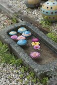 Pottery floating balls floating in granite trough