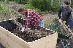 Build a raised flower bed of boards