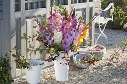 Late summer bouquet with Gladiolus (gladiolus), branches of Malus