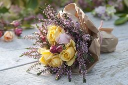 Autumn bouquet of pink (roses) and calluna (budding broom heather)