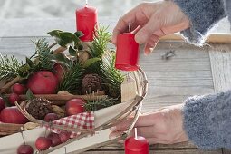 Fruit vine as unusual Advent wreath filled with apples