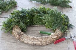 Advent wreath made of mixed greenery