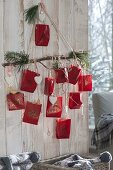 Homemade advent calendar with numbered red paper bags