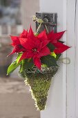 Christmas star as door decoration in a bag made of hare wire