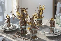 Table decoration with witch hazel and hazel branches