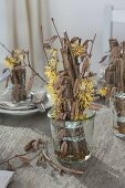 Table decoration with witch hazel and hazel twigs