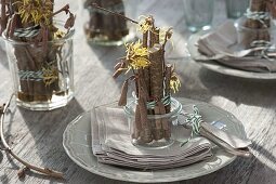 Table decoration with witch hazel and hazel twigs