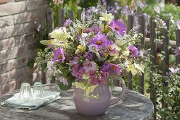 Pink-yellow bouquet of cosmos (jewel basket), lavatera (mallow)