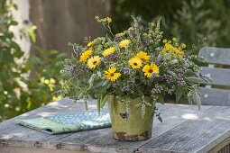 Bouquet of summer flowers and flowering herbs