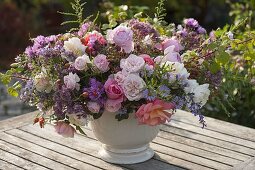 Autumn bouquet of pinks (roses, rose hips), aster (autumn asters)