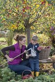 Woman with children at the apple harvest