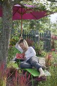 Green Liege with parasol under apple tree