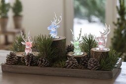 Christmas forest decoration with colored LED light deer