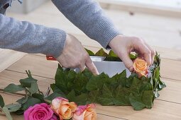 Gift box stuck with ivy leaves