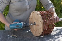 Build hanging basket out of wicker and floor wood