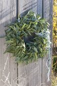 Wreath made from cutback of Eucalyptus on old wooden door