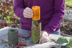 Natural candle deco on the window