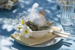 White Easter table decoration on the terrace