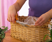 Basket with crocus, daffodils, hyacinths, tulips, puschkinia