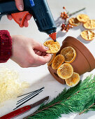 Candle decoration - Clay pot with dried orange slices