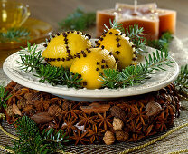Decorate lemons with cloves