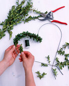 Wrap wire hearts with book branches, twigs on wire tie