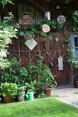 Wooden door from the garden house with deco, elder