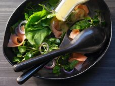 A smoked salmon salad with cucumber, sorrel and watercress with a tarragon mustard