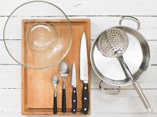 Kitchen utensils for making an octopus and vegetable salad