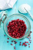 Lingonberries in a flip-top preserving jar