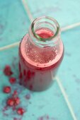 Lingonberry juice in a glass bottle