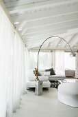 Arc lamp in lounge area with glass walls