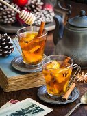 Hot winter spiced tea on a Christmas background