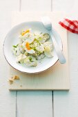 North German potato salad with mayonnaise, pickled cucumbers and egg