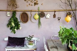 Mediterranean decorations hung on lilac wall on Mediterranean loggia