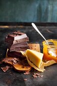 Ingredients for layered cake: chocolate, apricot jam and marzipan