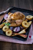 Roast chicken with roasted apples, onion and parsnips.