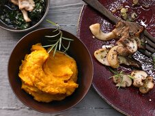 Pumpkin puree with fried mushrooms and pumpkin pesto