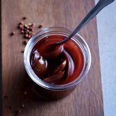 Balsamic plums with ginger and Sichuan pepper in a preserving jar