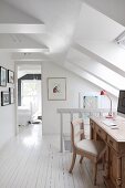 Wooden desk and chair in attic hallway