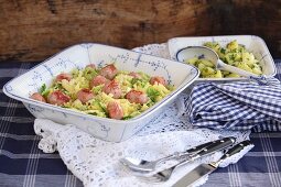 Creamed savoy cabbage with sausage dumplings and parsley potatoes