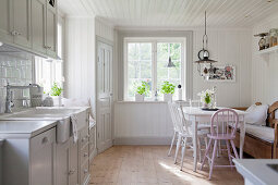 Country-house-style kitchen-dining room flooded with light