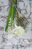 Floral linen napkin, vintage forks and white spring flowers